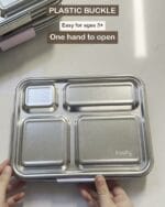 Hands opening the Bento 4+ plastic buckle one-handed, captioned as easy for ages three and up