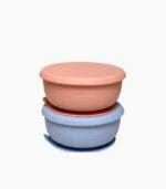 Beige and blue porcelain baby bowls stacked with lids on