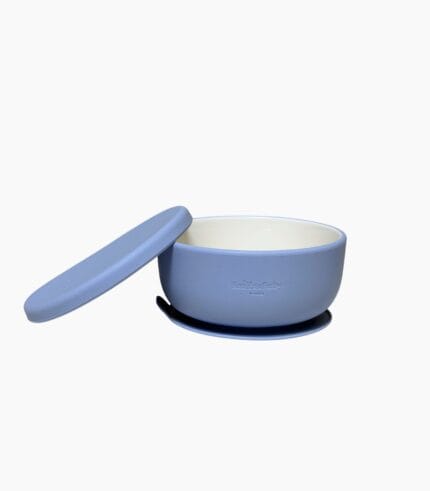Blue porcelain baby bowl with silicone suction sleeve and matching lid