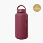 Kaally Glass Sports Bottle in Mulberry with the Clean + Conscious Awards 2026 Gold Winner rosette, Best Reusable Bottle / Cup