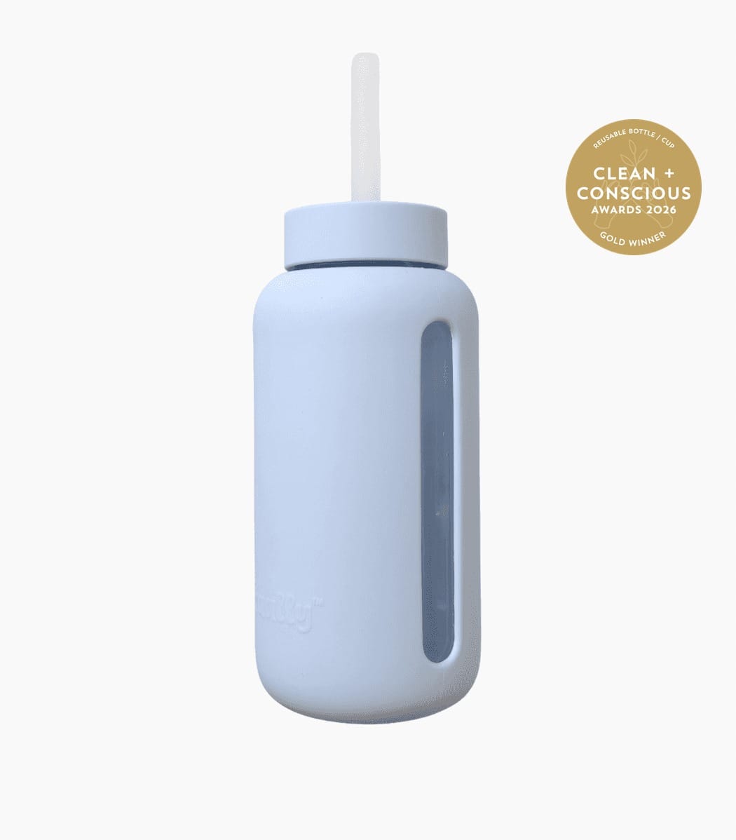 Kaally Glass Smoothie Bottle — Sky Blue, Gold, Clean + Conscious Awards 2026 Kaally Glass Smoothie Bottle in Sky Blue with the Clean + Conscious Awards 2026 Gold Winner rosette, Best Reusable Bottle / Cup