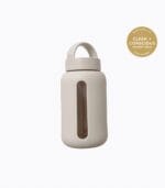 Kaally Glass Sports Bottle in Almond with the Clean + Conscious Awards 2026 Gold Winner rosette, Best Reusable Bottle / Cup