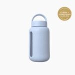 Kaally Glass Sports Bottle in Sky Blue with the Clean + Conscious Awards 2026 Gold Winner rosette, Best Reusable Bottle / Cup
