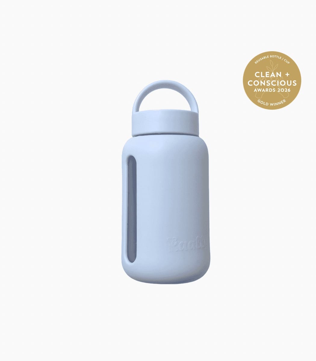 Kaally Glass Sports Bottle — Sky Blue, Gold, Clean + Conscious Awards 2026 Kaally Glass Sports Bottle in Sky Blue with the Clean + Conscious Awards 2026 Gold Winner rosette, Best Reusable Bottle / Cup