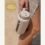 Kaally Glass Bottle in Almond with the Gold rosette — Best Reusable Bottle / Cup, Clean + Conscious Awards 2026